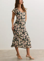 Floral midi maternity dress with short flutter sleeves and fitted empire waist in soft fabric.