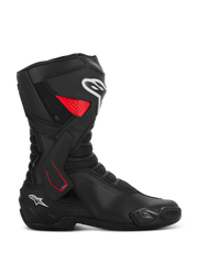 Alpinestars SMX-6 V3 Drystar Boots, motorcycle sport riding boots, black with red and white accents, side profile view, waterproof microfiber construction, TPU lateral ankle brace with red detailing, white logos on the shin and heel, integrated toe slider and mesh flex zones