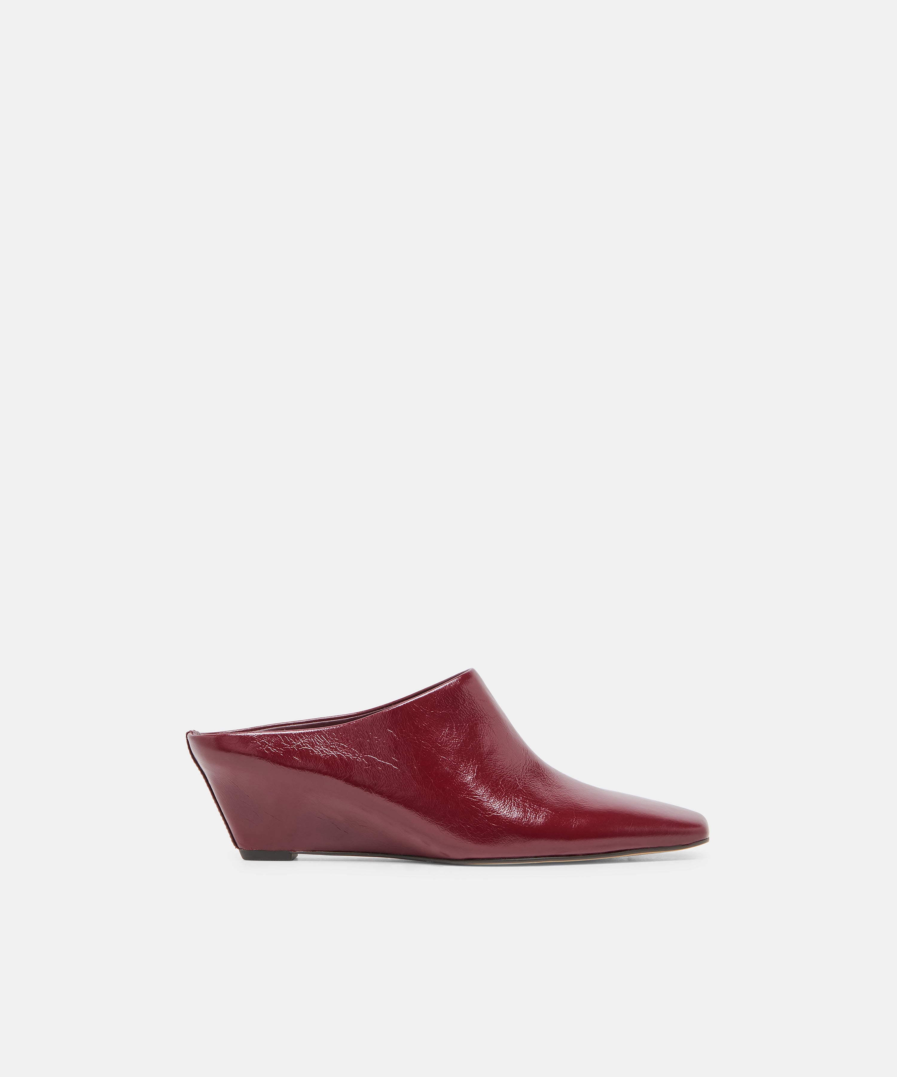 HILAH Oxblood Crinkle Patent Closed-Toe Slip-On Wedge Mules | Dolce Vita